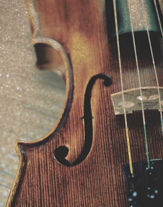 old violin requiring repair services